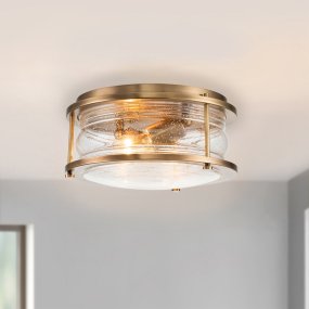 Ashland Bay Ø30 Messing badeværelseslampe Fra Elstead Lighting - Den er lavet af stål og glas og tilbyder en luksuriøs messingfinish og plads til to.