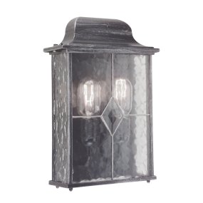 Wexford Sølv udendørslampe Fra Elstead Lighting - Wexford er en klassisk udendørs væglampe, fremstillet af aluminium med en elegant mørk sølvfinish og dekorative glaspaneler med blyindfattet mønster.