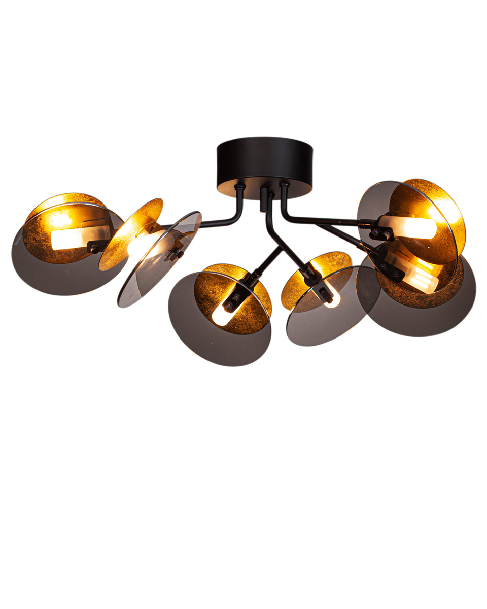 Turno 70cm Sort plafond Fra By Rydéns - D&aring; Turno plafond har ingen bagside, du kan vælge om du vil have lyskilderne, som er anbragt i et rør af matteret glas, skal være i fokus eller om du foretrækker dem skjult og s&aring; så udstråle på siderne bag den guldfarvede metalskive.