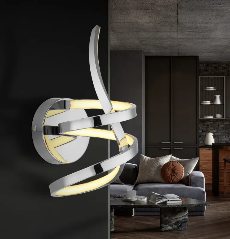 Iduna Ø35 Chrom væglampe Fra Globo Lighting - Iduna &auml;r en v&auml;gglampa som imponerar med sin unika design, d&auml;r den eleganta b&ouml;jda formen och den stilfulla knuten i mitten skapar en modern estetik.