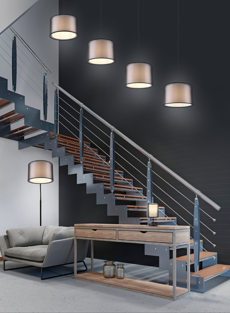 Burton Sort gulvlampe Fra Trio Lighting - Den moderne kombination af en indvendig hvid stofskærm og en udvendig gennemsigtig sort plastikskærm ser både individuel og forfriskende ud og kan integreres i moderne livsstil ved; mange måder.