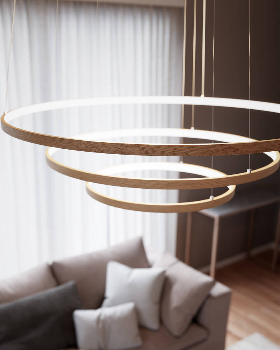 Trione Ø80 Træ loftslampe Fra By Rydéns - Hver ring (80 cm, 60 cm og 40 cm i diameter) kan nemt justeres i højden og positionen med lampens trådsten.