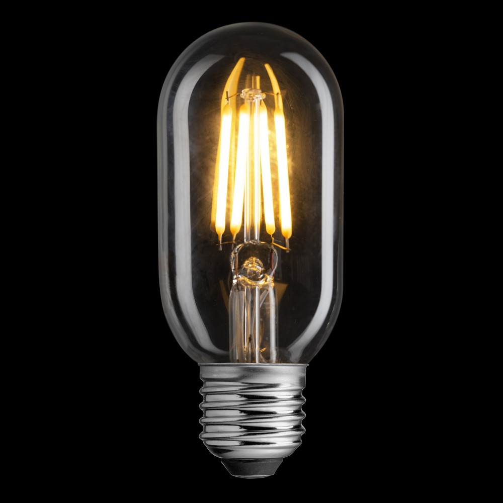 E27 sensor 4W 2200K Gennemsigtig Fra Unison - Dens klassiske r&oslash;rform og klare glas g&oslash;r den perfekt til dekorative armaturer, samtidig med at den tilbyder en energieffektiv l&oslash;sning med moderne LED-teknologi.