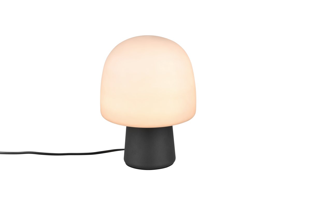 Steen 27cm Sort bordlampe Fra Trio Lighting - Med sin svampeformede silhuet og kombinationen af en matsort bund og taupefarvet glasskærm bliver den et stilfuldt blikfang i ethvert rum.