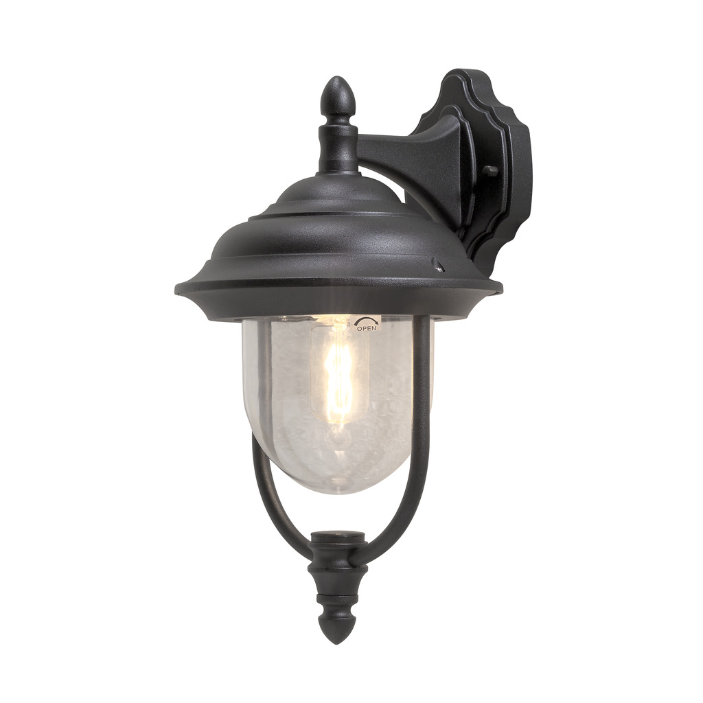 Parma Sort udendørslampe Fra Konstsmide - Med sin smukke form og klare glaskuppel spreder den et varmt og imødekommende lys, ideelt til entre og terrasser.