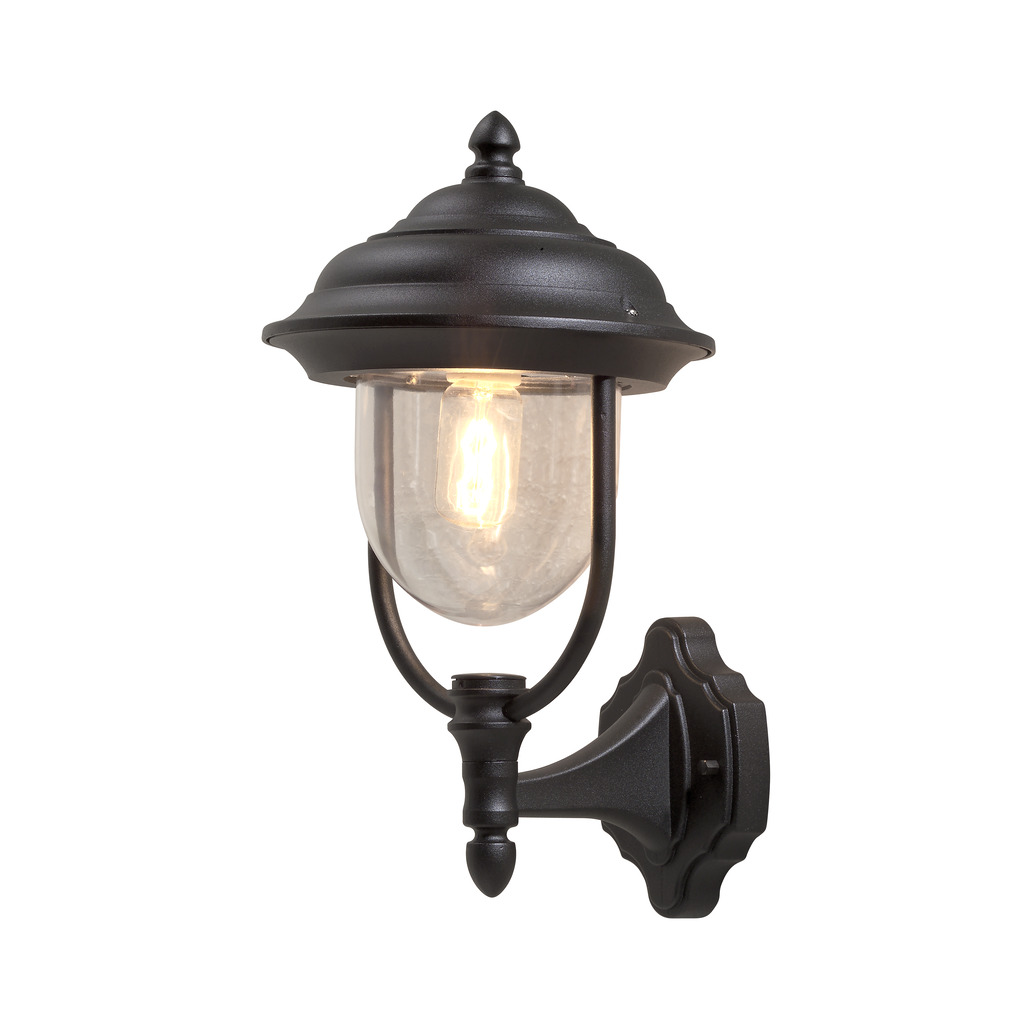 Parma Sort udendørslampe Fra Konstsmide - Med sin smukke form og klare glaskuppel spreder den et varmt og imødekommende lys, ideelt til entre og terrasser.