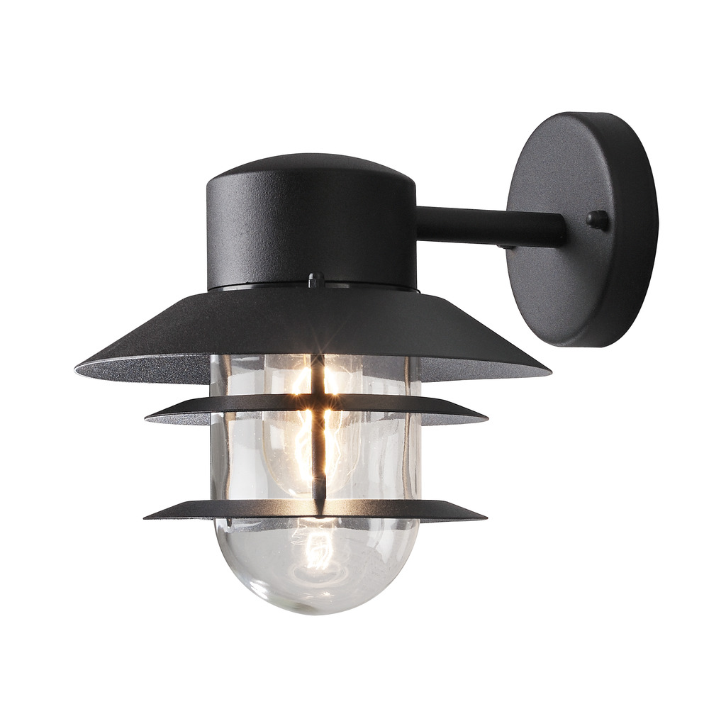 Modena Sort udendørslampe Fra Konstsmide - Med sit beskyttende tag og stilfulde design giver den et behageligt og rettet lys, ideelt til at skabe en tryg og indbydende atmosfære udendørs.