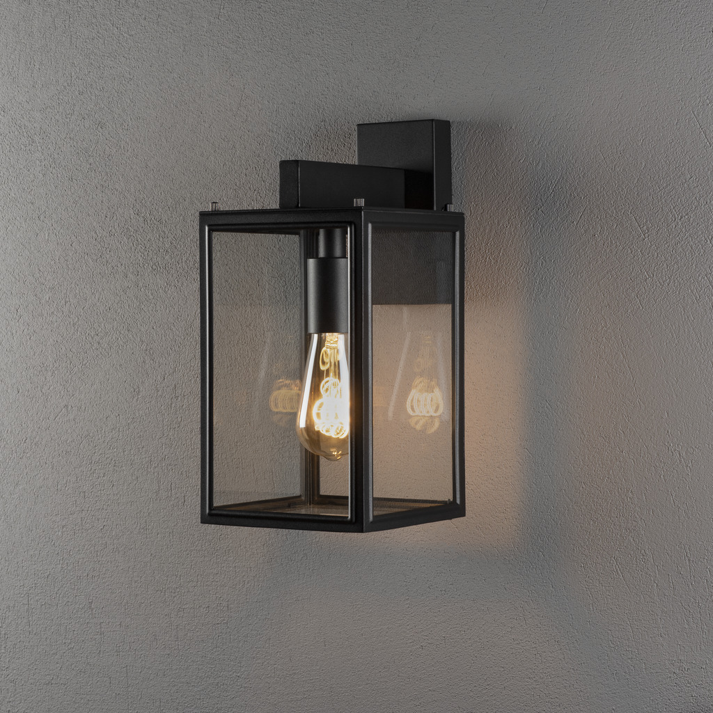 Carpi Sort udendørslampe Fra Konstsmide - Den er lavet af slidstærke materialer og modstår de barske vejrforhold og er både en æstetisk og funktionel belysningsløsning til dit hjem.
