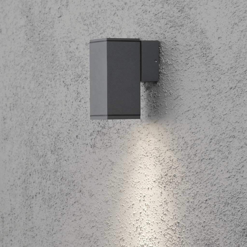 Monza Mørkegrå udendørslampe Fra Konstsmide - Med sit terningformede design og direkte lys er den ideel til at skabe en sofistikeret atmosfære i entre og gange.