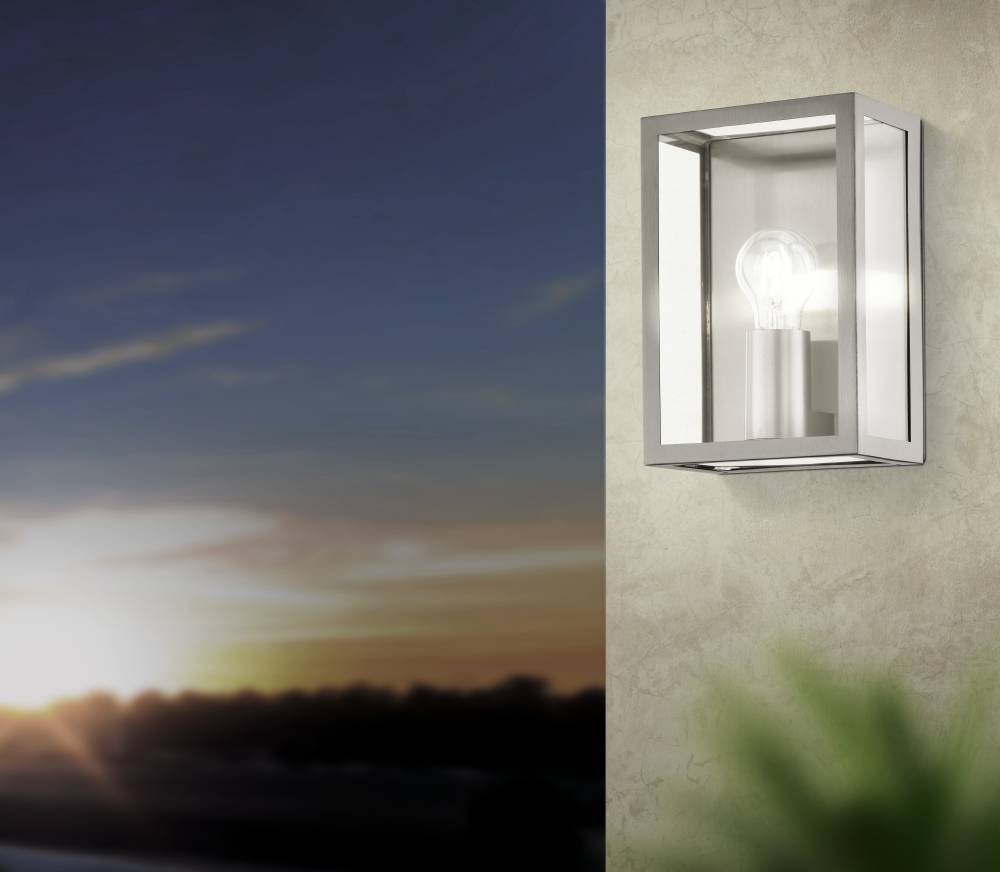 Alamonte Rustfrit stål udendørslampe Fra Eglo - Den åbne metalramme i børstet stål giver en industriel følelse og fremhæver den synlige pære for et stilfuldt udtryk.