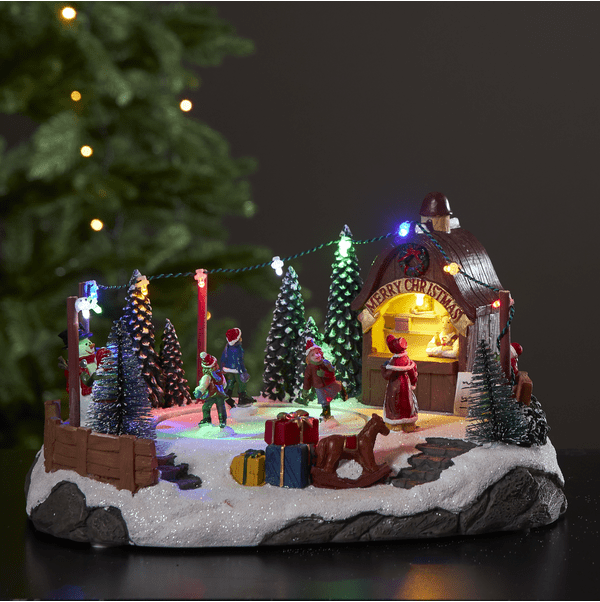 Iceville Flerfarvet Fra Star Trading - Fantastisk dekoration til jul eller advent med en lille skøjtebane, der roterer og spiller musik.