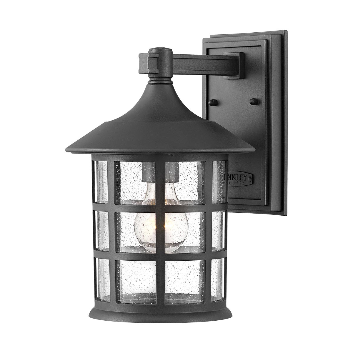 Freeport 30cm Sort udendørslampe Fra Elstead Lighting - Den er lavet af vejrbestandig komposit og glas og tilbyder en robust og langtidsholdbar konstruktion, der tåler hårde udendørsforhold uden at ruste eller korrodere.