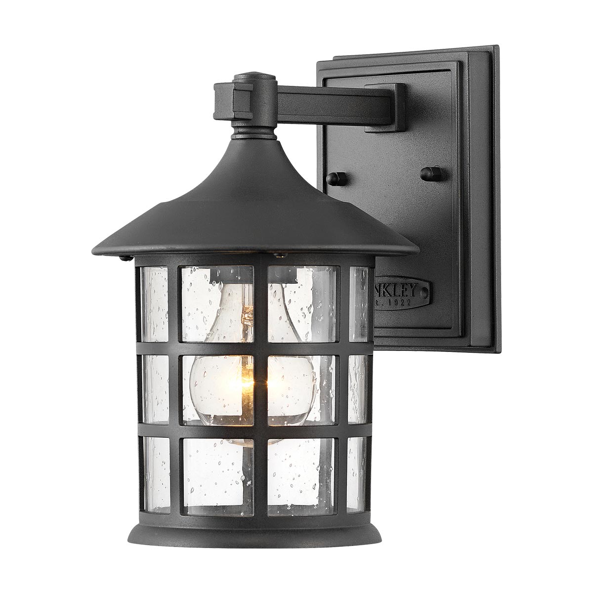 Freeport 24cm Sort udendørslampe Fra Elstead Lighting - Den er lavet af vejrbestandig komposit og glas og tilbyder en robust og langtidsholdbar konstruktion, der tåler hårde udendørsforhold uden at ruste eller korrodere.